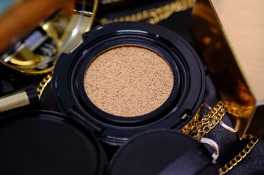 depositphotos_114752616-stock-photo-cosmetics-gold-set-for-background.jpg